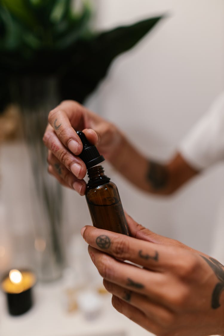 Man Holding Serum Bottle