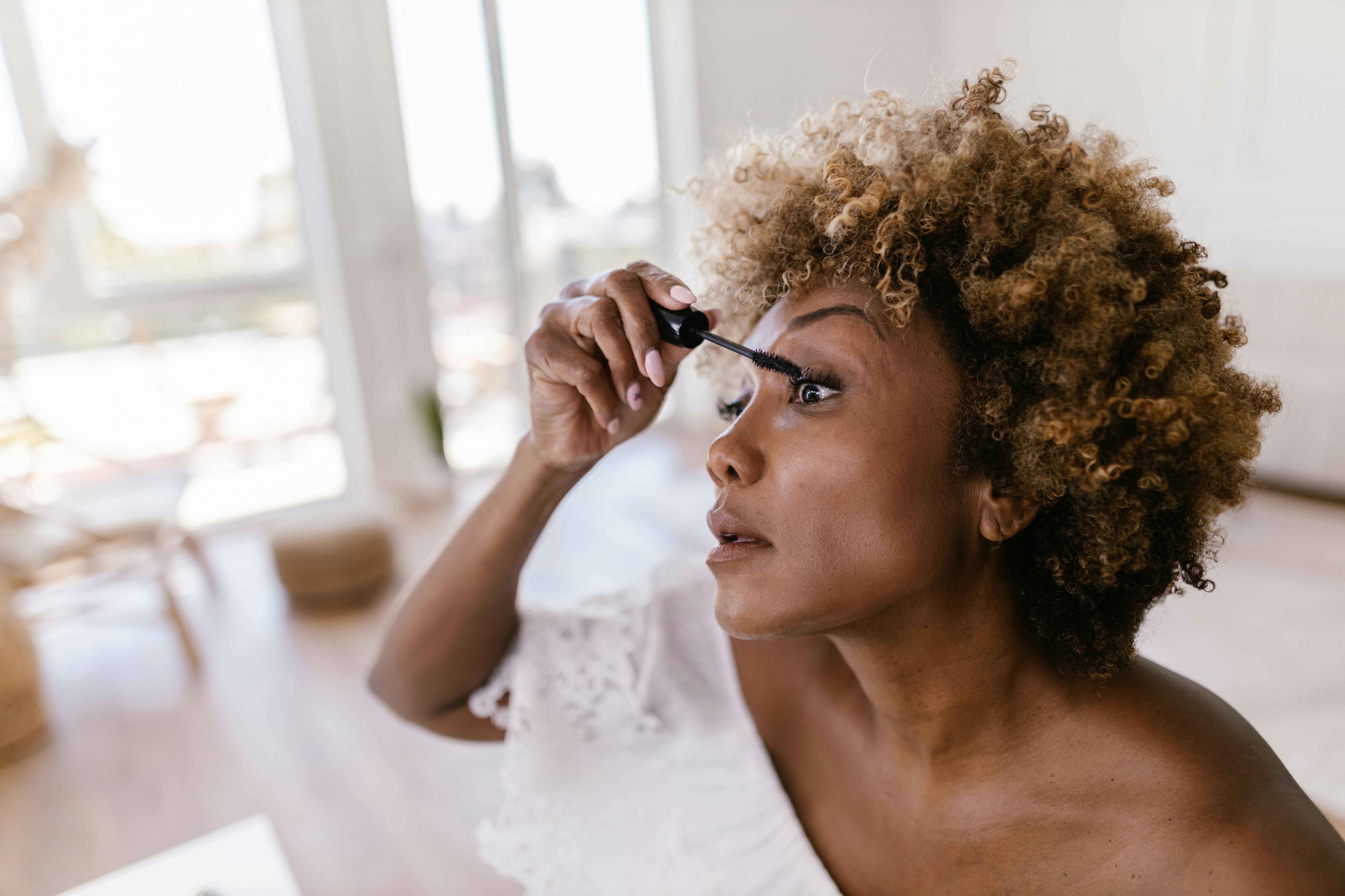 woman applying mascara