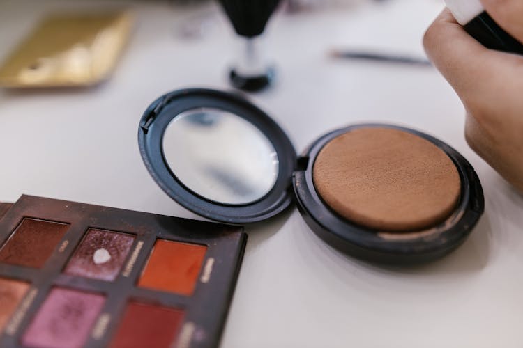 Close-up Of Makeup Products On Table