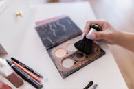 Black Makeup Brush on White Table