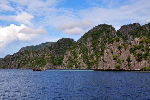Free Breathtaking view of limestone cliffs and clear sea in El Nido, Philippines, under a bright sky. Stock Photo
