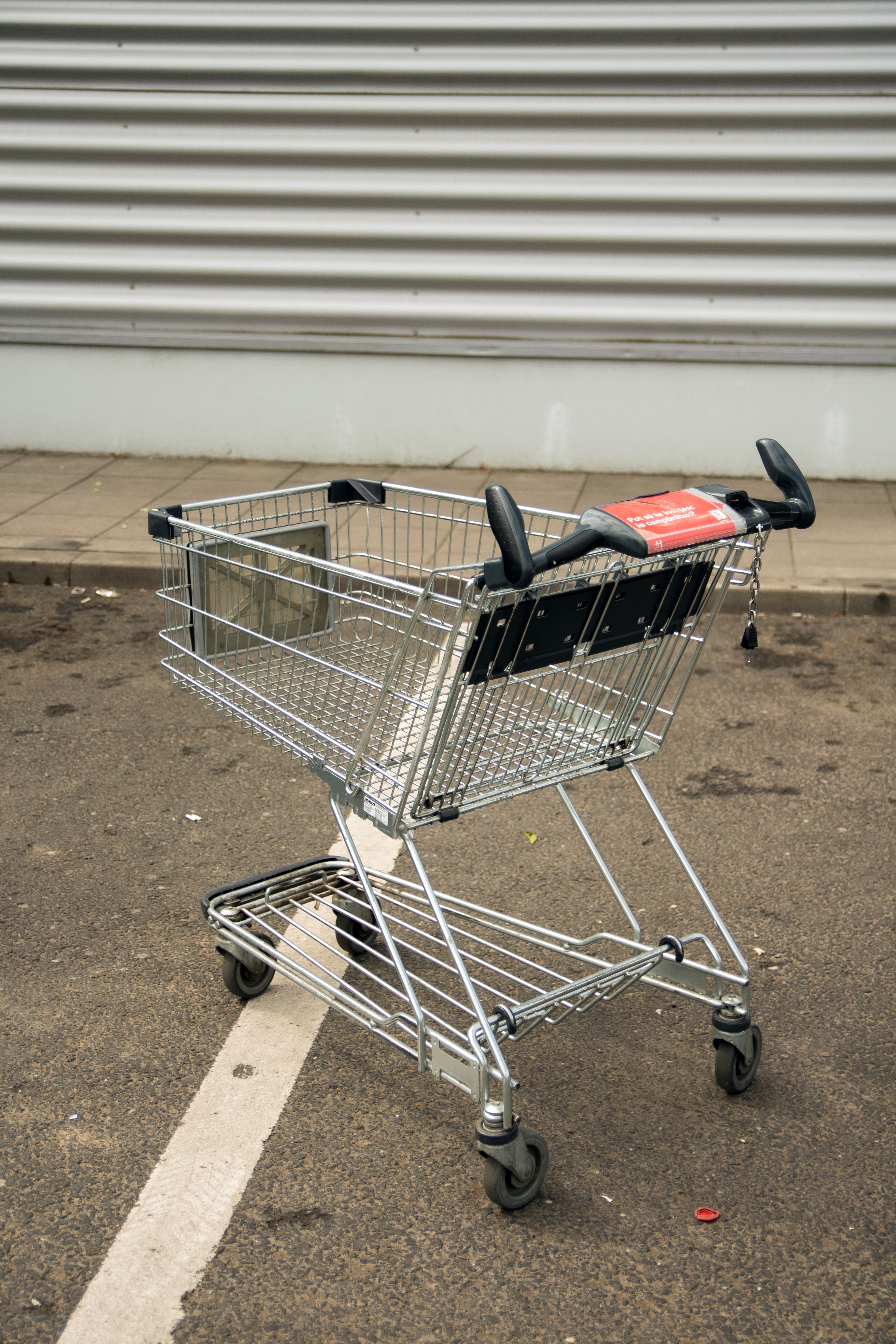 small rolling utility cart holding coffee mugs and a pour over set