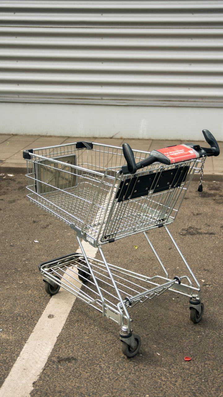 small rolling utility cart holding coffee mugs and a pour over set