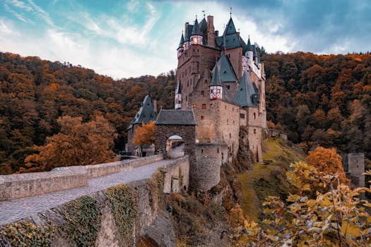 Explore the enchanting Eltz Castle amidst vibrant autumn foliage in Wierschem, Germany.