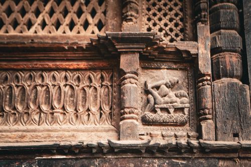 Free Intricate stone relief sculpture on historic facade, showcasing elaborate carvings and design. Stock Photo
