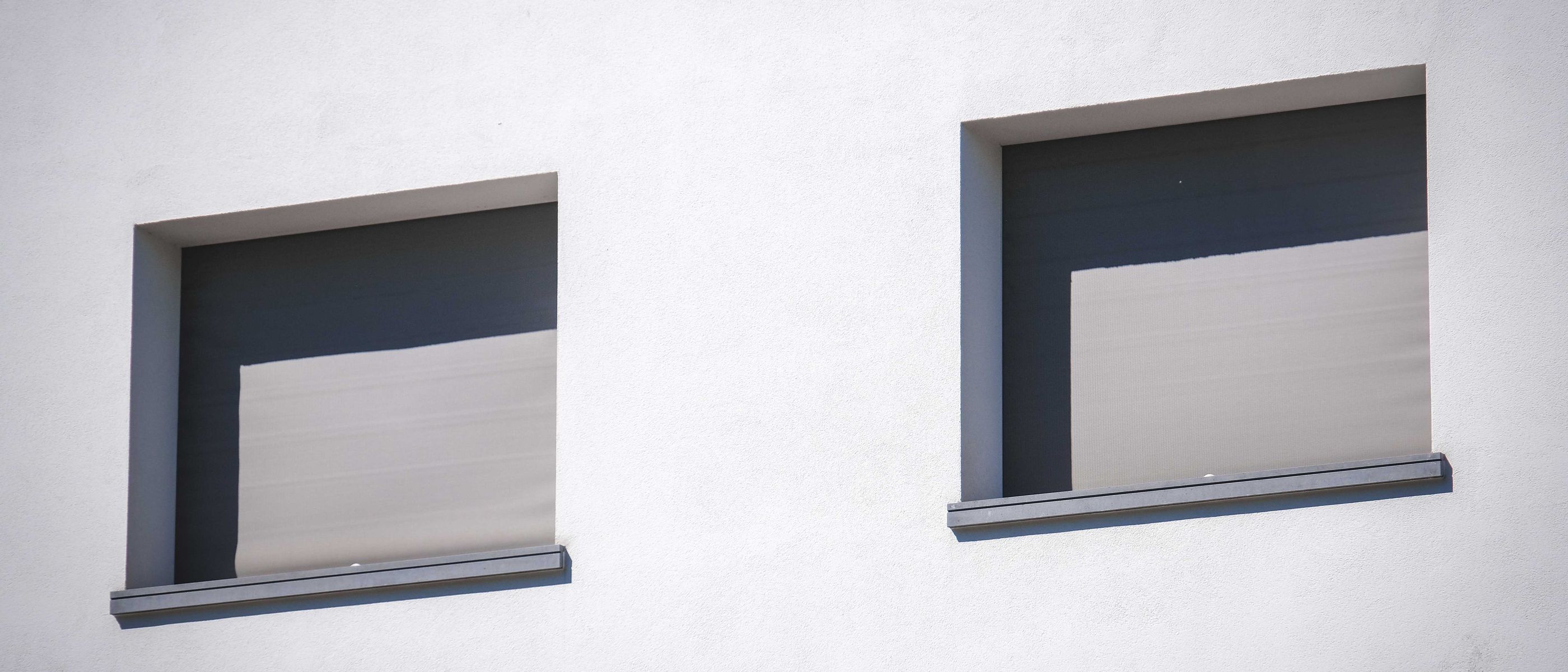 uPVC Spraying in Raynes Park — clean edges cut in around trim and sockets