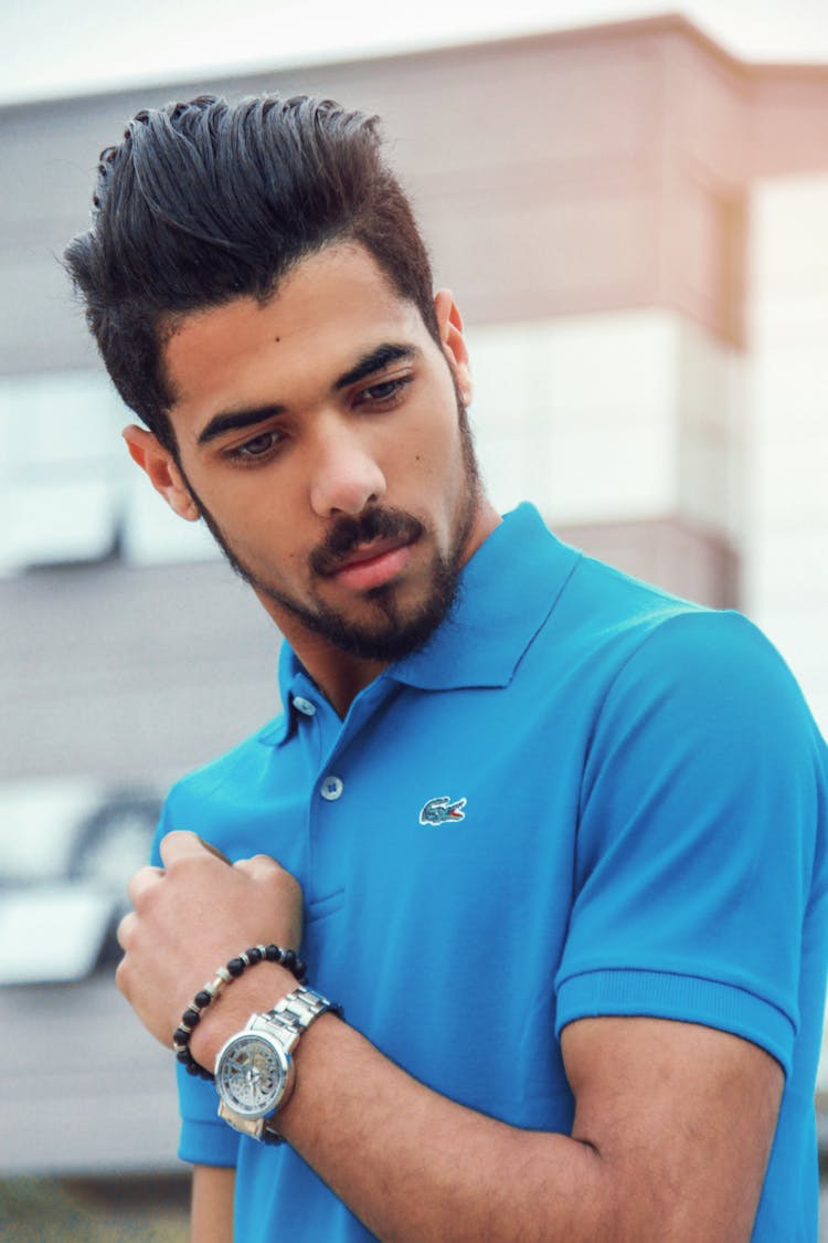 Man Wearing Blue Lacoste Polo Shirt And Silver-colored Analog Watch