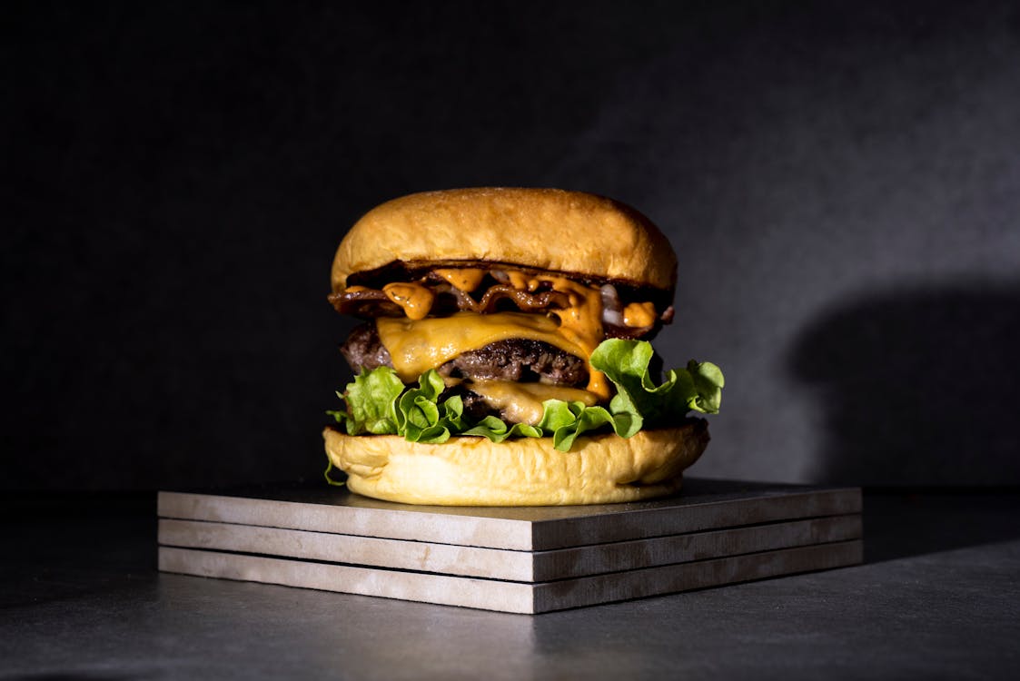 Free Burger on Brown Wooden Table Stock Photo