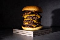 Studio Shot of a Multi-Layered Cheeseburger