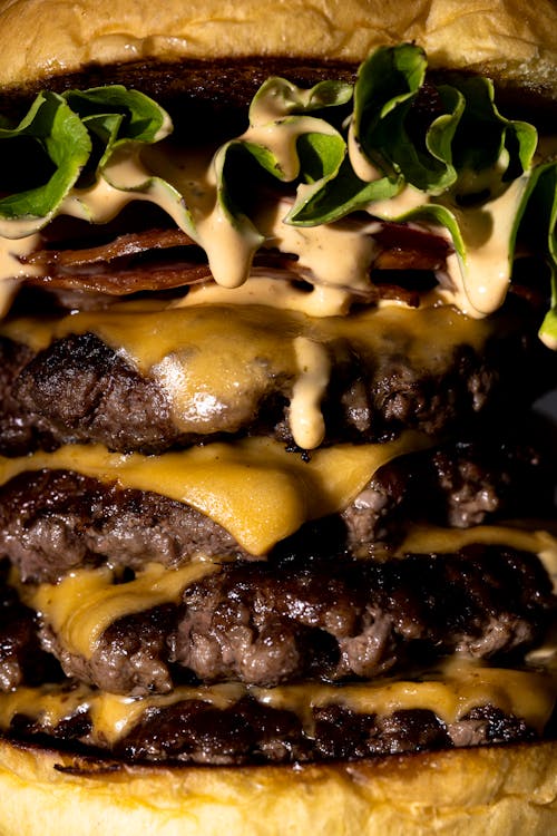 Close up of a Multi-Layered Cheeseburger