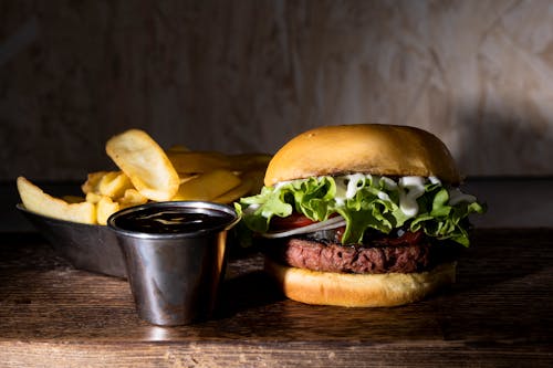 Burger and Fries on a Wooden Board 