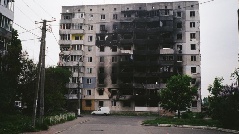 A heavily damaged apartment building in Borodyanka, Ukraine, illustrating urban devastation.