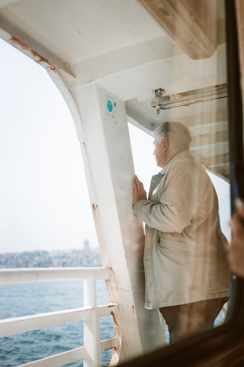 A Man Standing on the Ferry Boat
