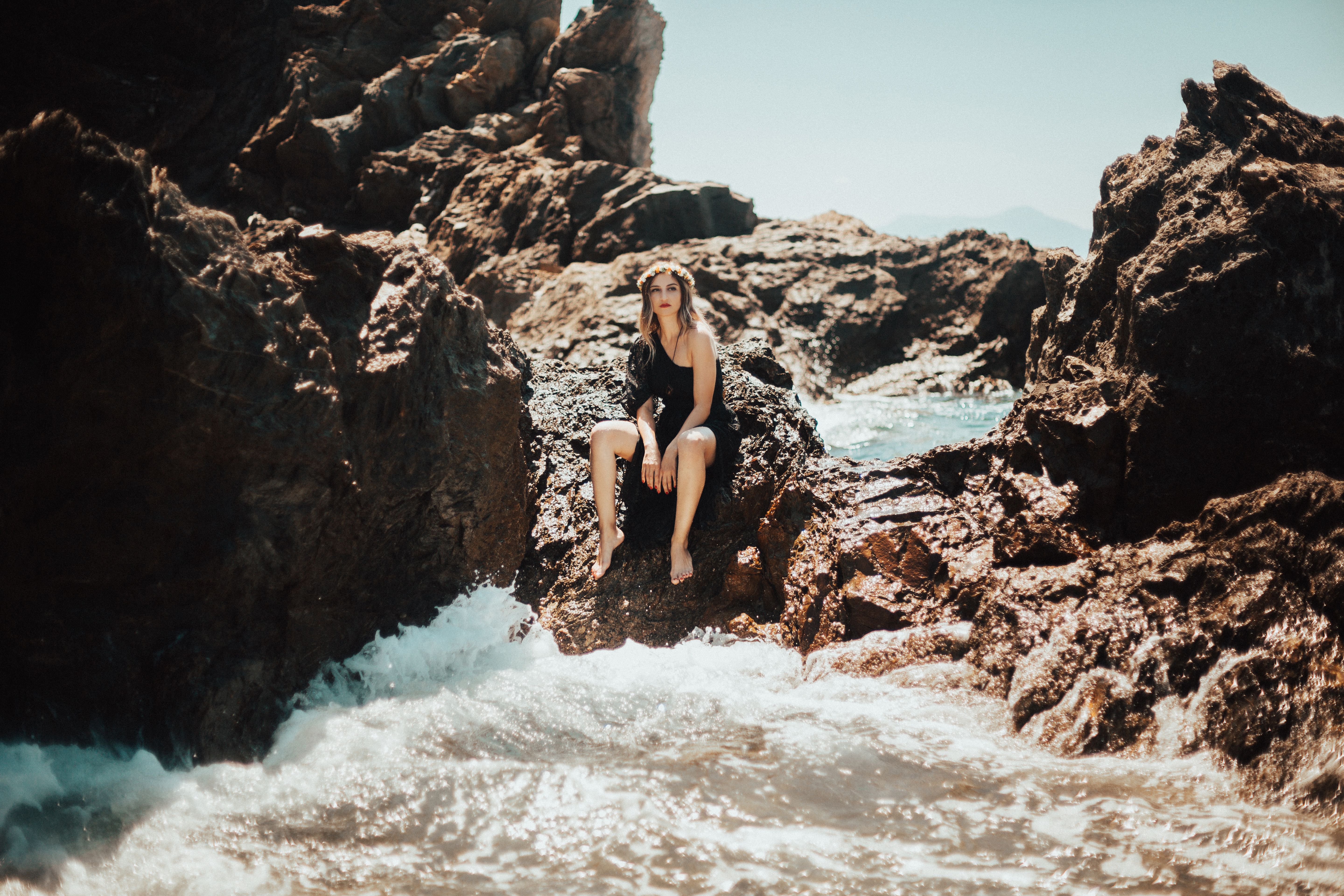 Woman Sitting on Rock · Free Stock Photo