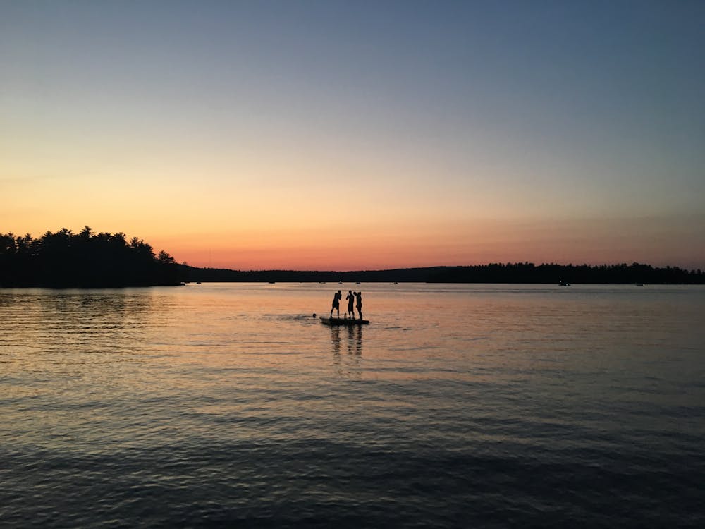 Free stock photo of kids on a raft, lake at sunset, little sebago