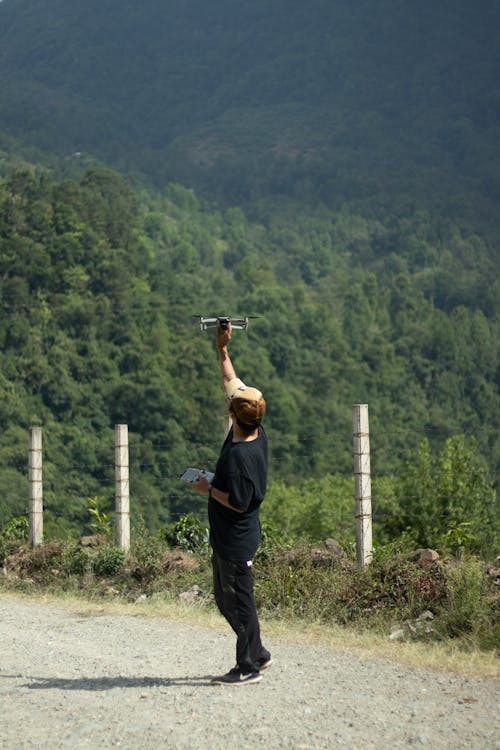 A Man Holding a Drone Camera