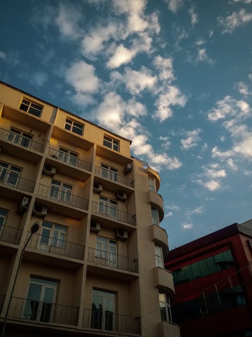 An Apartment Building Under a Cloudy Sky