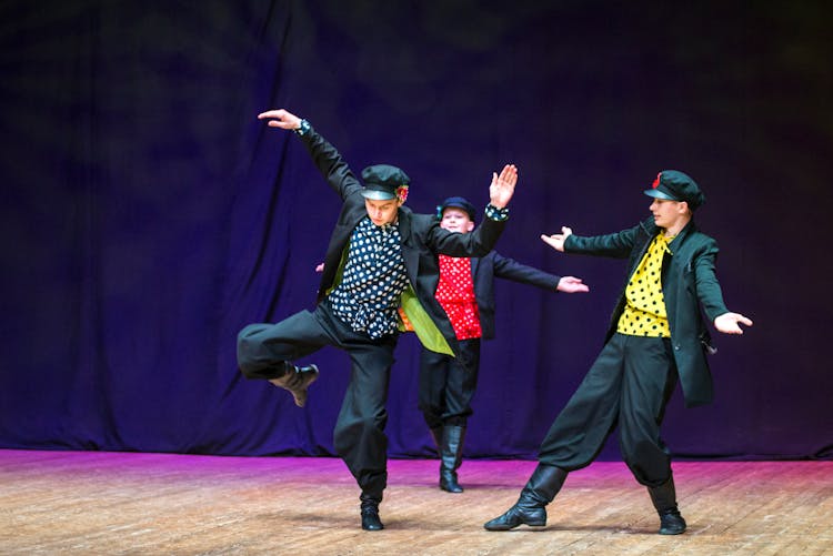 Photograph Of Boys Dancing On A Stage