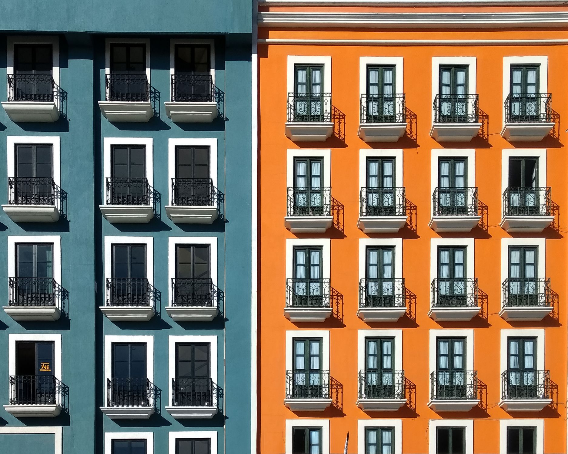 Vibrant building facades in Pachuca featuring modern architecture with contrasting colors.