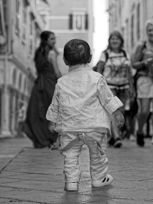 Grayscale Photograph of a Child Standing