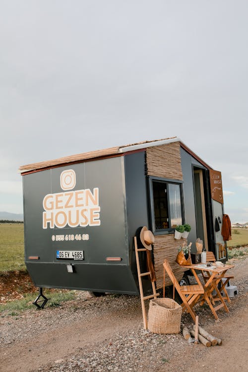 Black and Brown Tiny House on Road