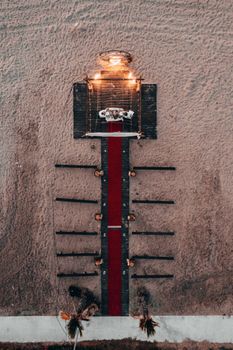 Aerial view of a beautifully decorated beach setup for a romantic wedding event.