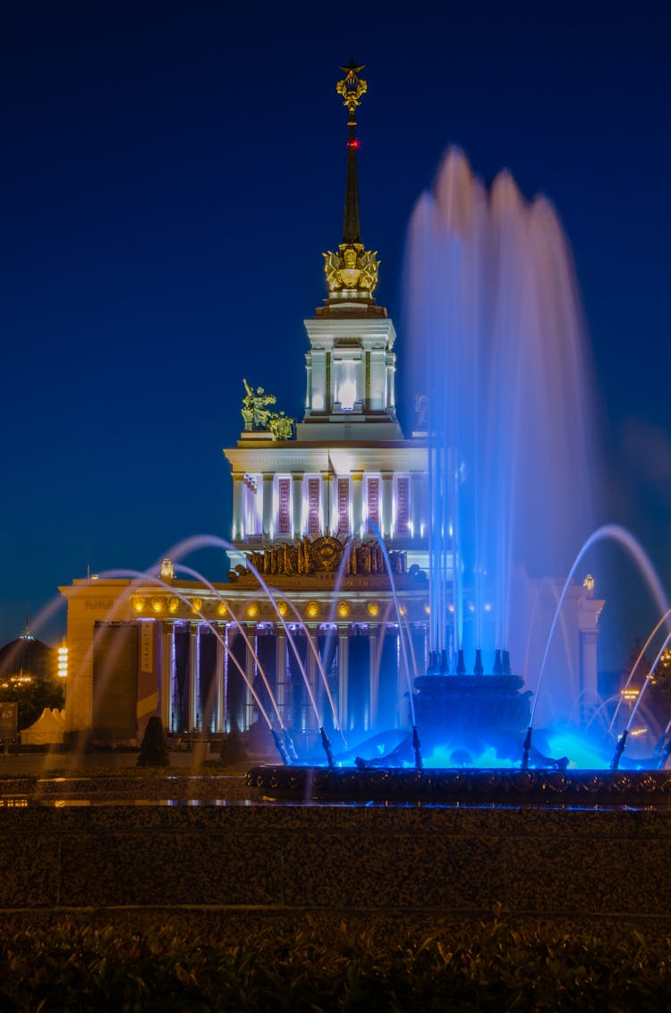 Fountain Near Administration Building In Lights At Night