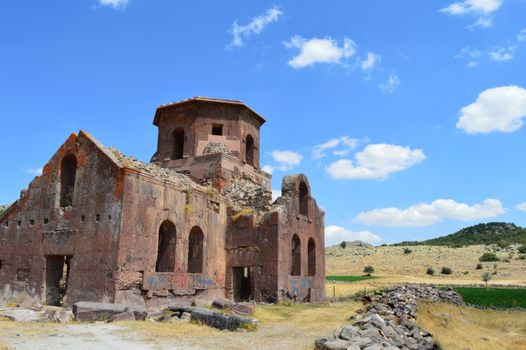 Explore the historical ruins of a Byzantine church under a clear blue sky in Aksaray, Turkey.
