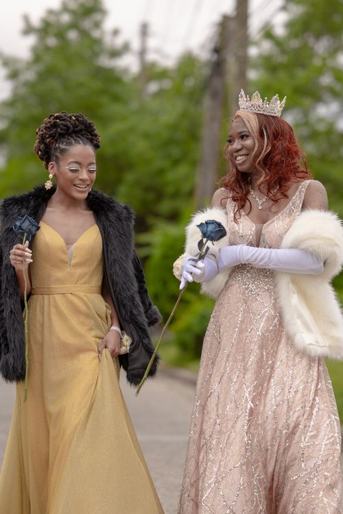 Free Two women enjoy a glamorous day outdoors in stylish prom dresses. Stock Photo