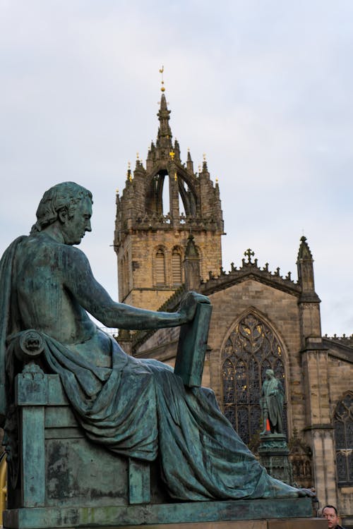 A Human Figure Sculpture Near the Church