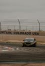 Black and Yellow Porsche 911 on Track Field