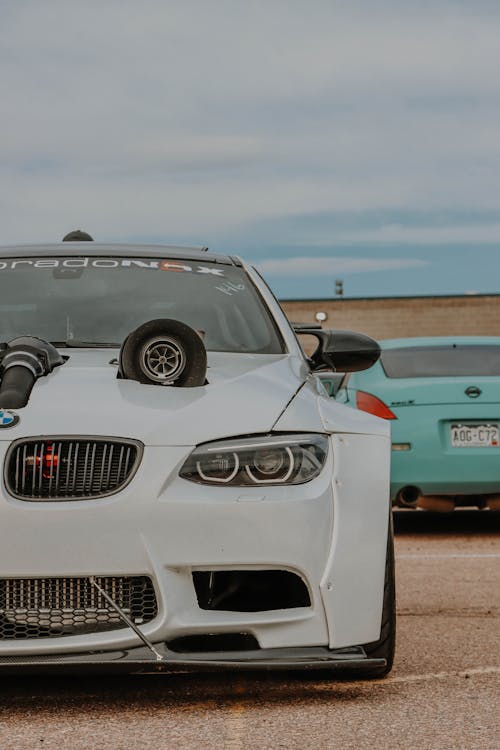 Free Parked White BMW on a Pavement Stock Photo