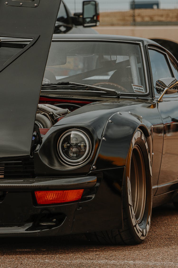 Close-up Photo Of Black Datsun 