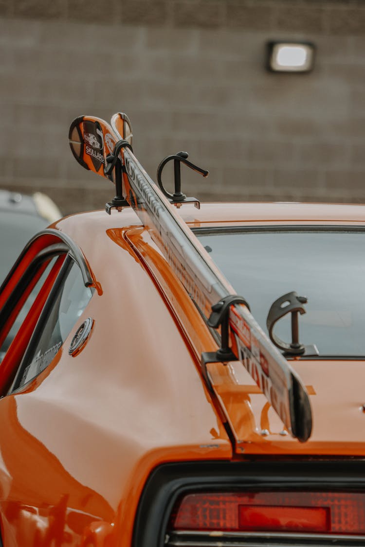 Orange Car With Skis On Top