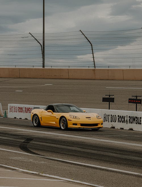 A Yellow Sports Car on the Road