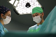 Surgeon performing plastic surgery