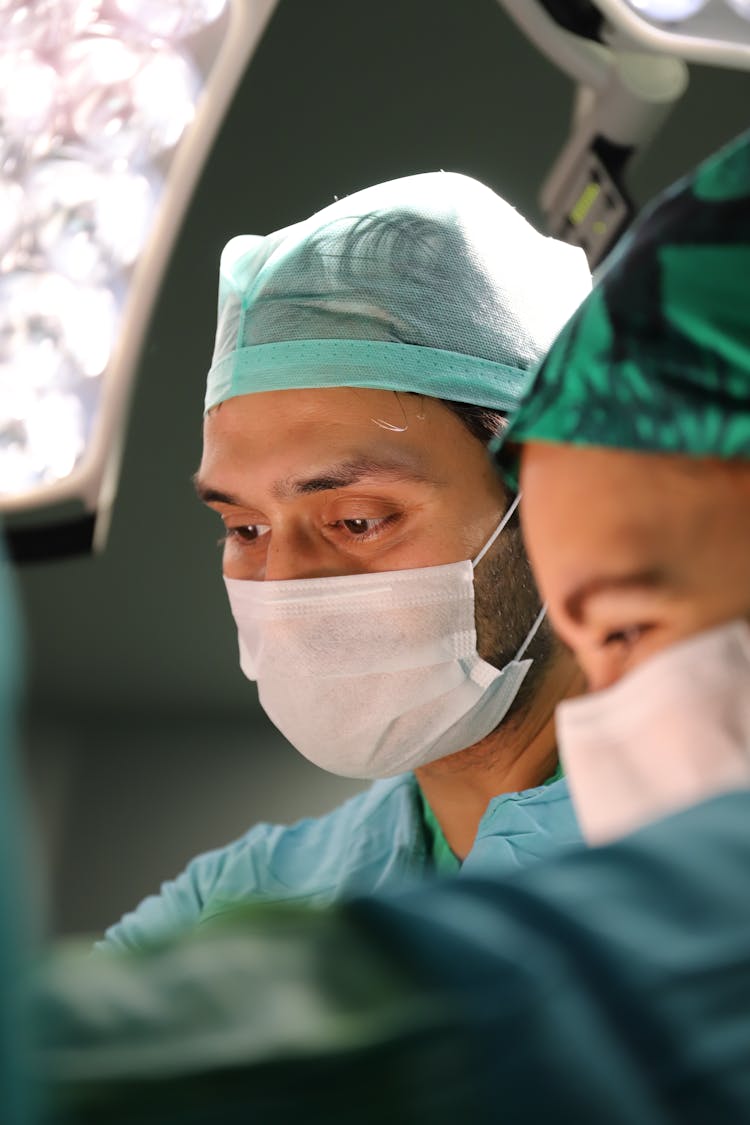 Surgeon Performing Surgery Inside Operating Room