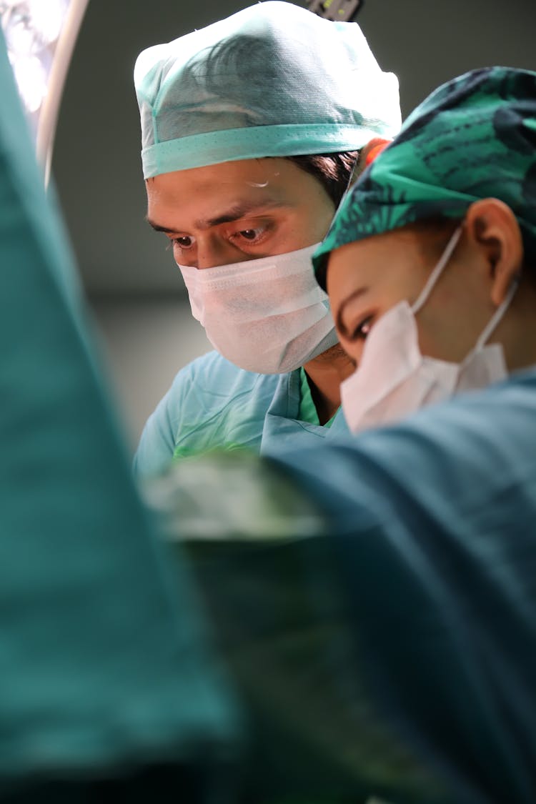 Surgeon Performing Surgery Inside Operating Room