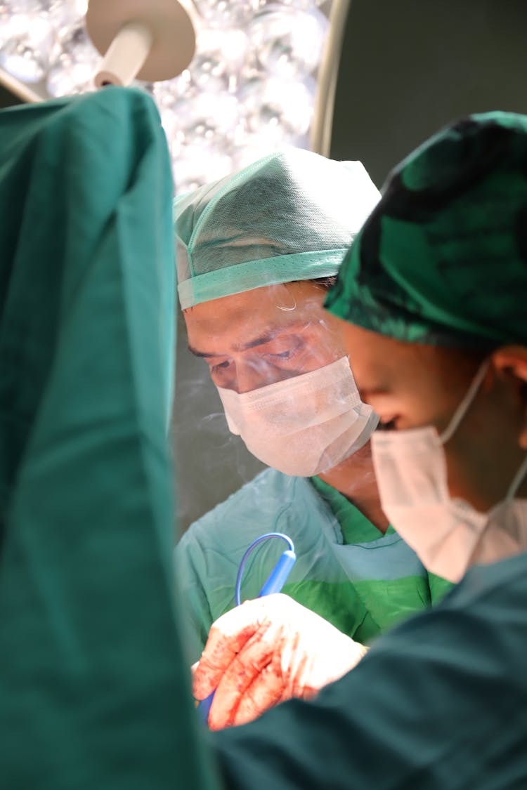 Surgeon Performing Surgery Inside Operating Room