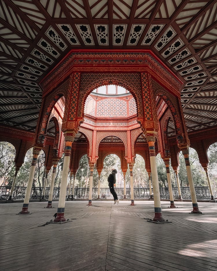 A Person Jumping In A Gazebo