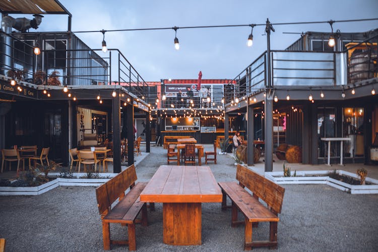 Wooden Table And Benches In Outdoor Patio