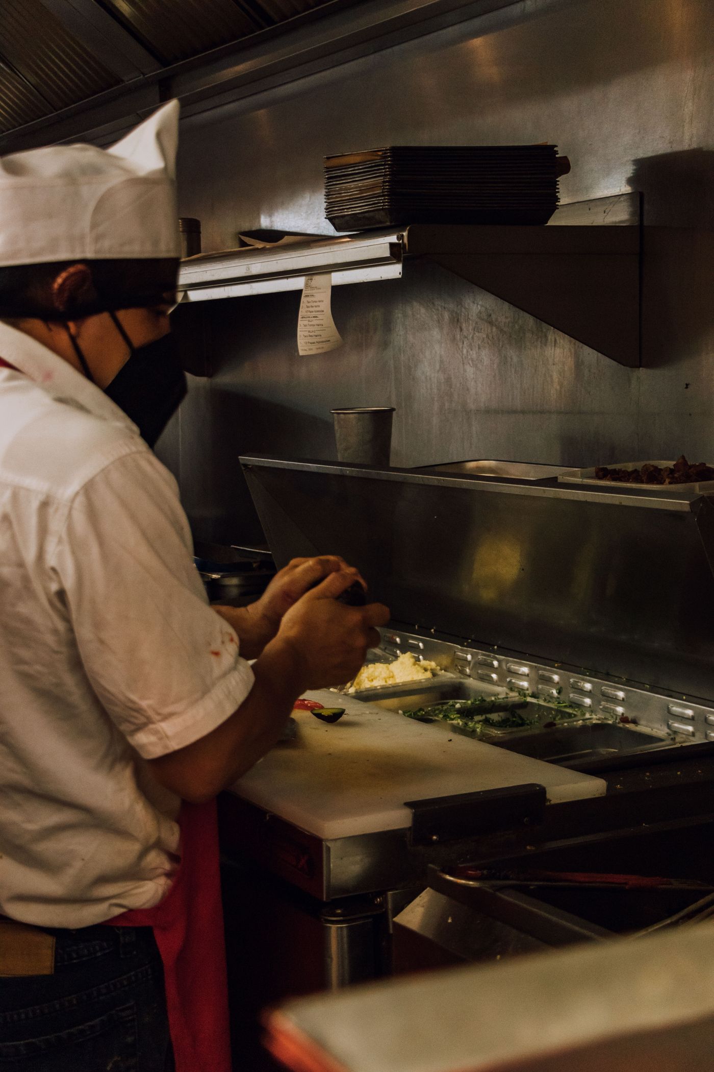 Chef preparing ingredients in a commercial kitchen