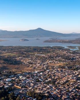 Stunning aerial view of Lake Pátzcuaro with nearby town and mountains in Mexico.