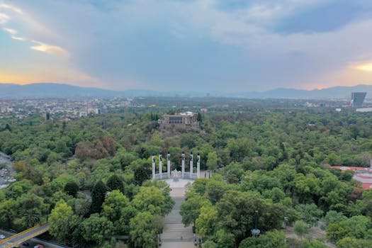 Stunning aerial view of Chapultepec Park and Mexico City at sunset.