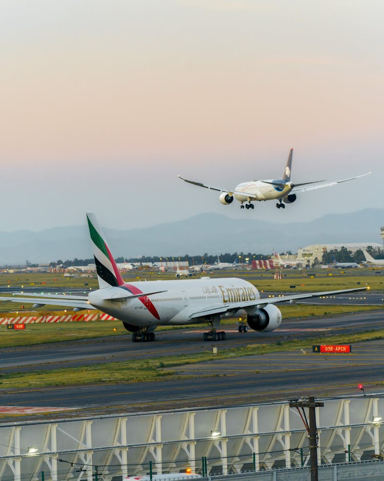 Red And White Airplane On The Runway