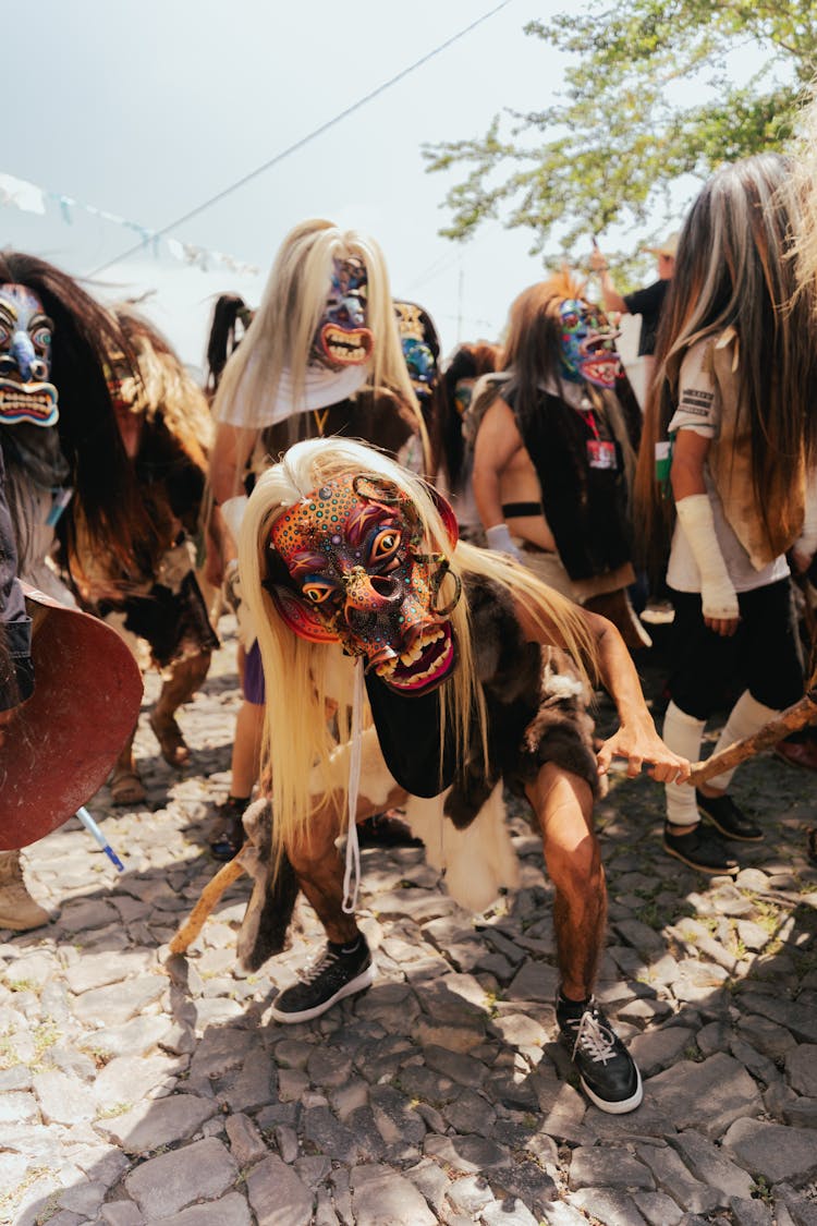 People In Masks During Festival