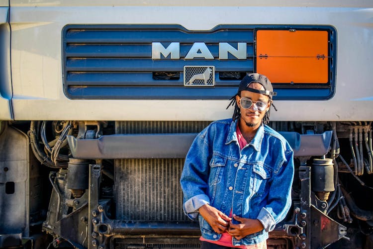 Man Standing In Front Of Truck