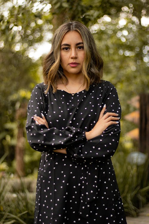 Serious Woman in Black Long Sleeve Dress 