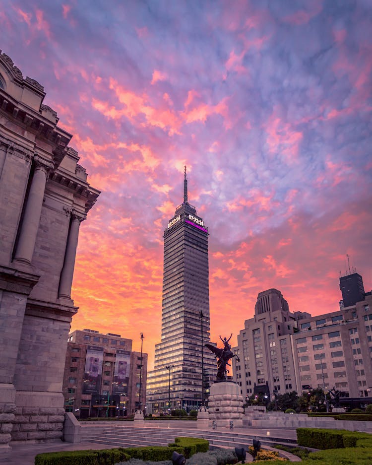 Clouds Over City At Sunset