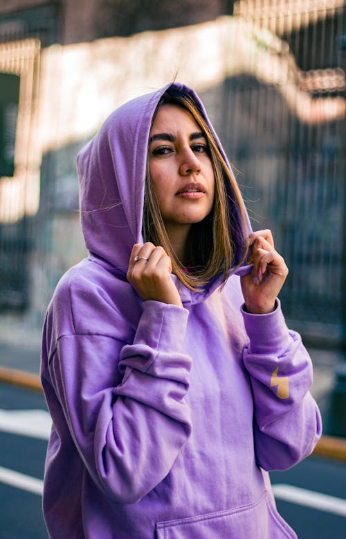 Pretty Woman Holding Her Purple Hoodie 